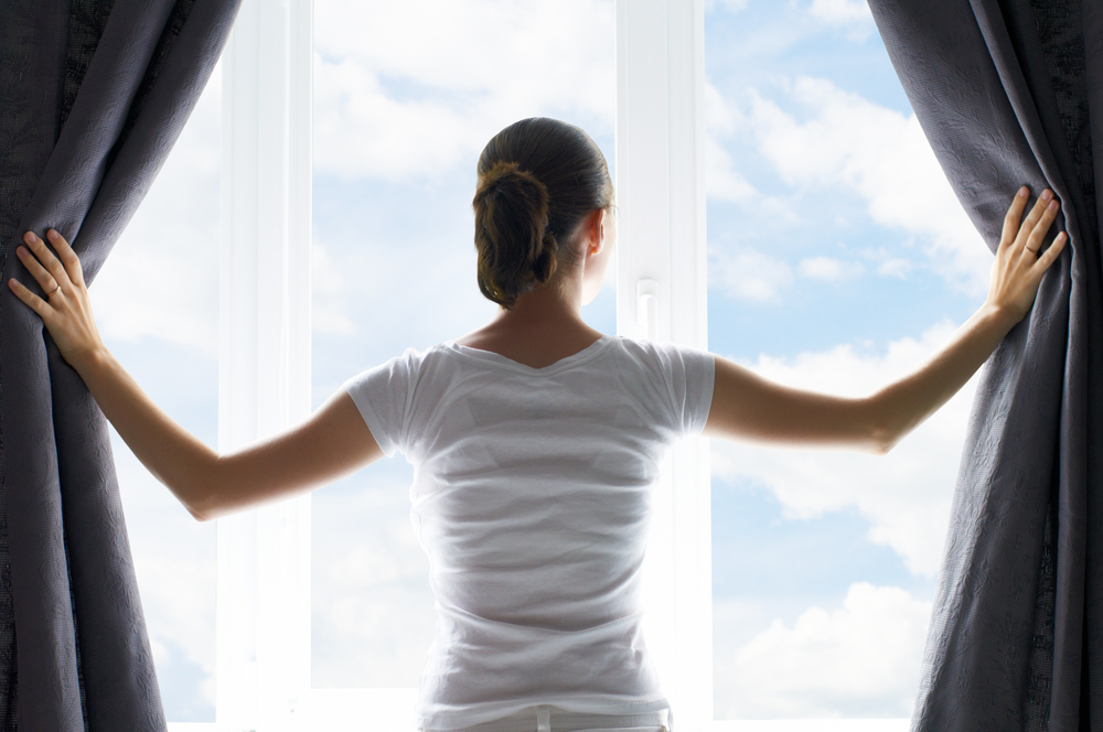 a woman breathing clean air in her home